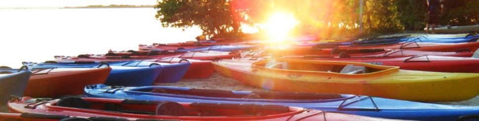 kayaks together on beach